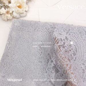 gambar bahan Kain kebaya laminating versace berwarna white silver